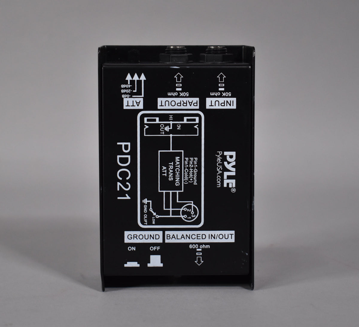 Black direct box, viewed from above, showing the top panel with two toggle switches and three 1/4" jacks.