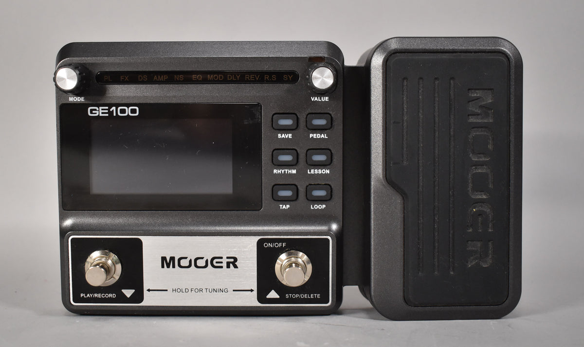 Dark gray multi-effects pedal with a large screen, two footswitches, two silver knobs, and a textured expression pedal on the right.