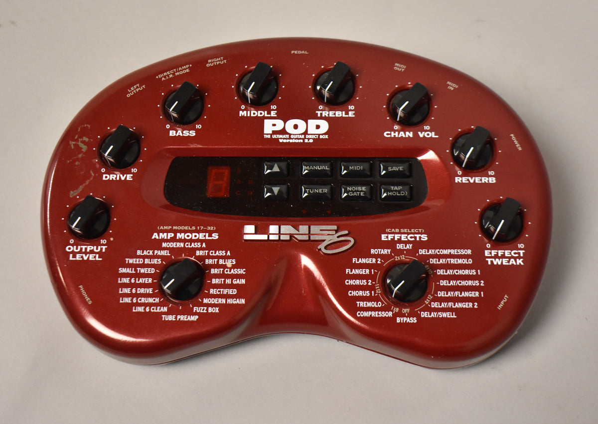 A top-down view of a red, kidney-bean-shaped multi-effects pedal with numerous black knobs, buttons, and a red digital display.