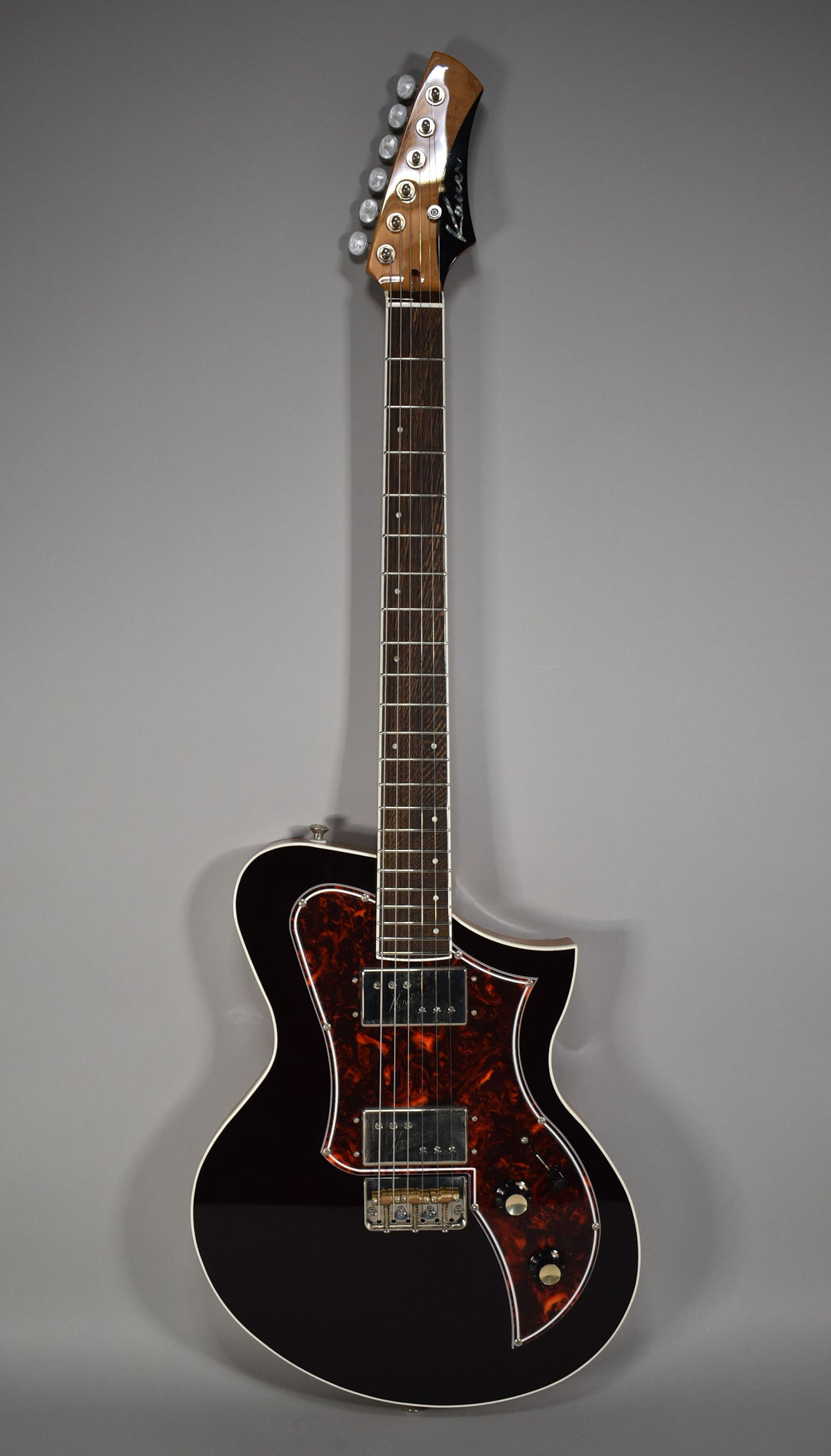 Full-length view of a dark oxblood guitar with a tortoiseshell pickguard, two humbuckers, and a tune-o-matic bridge.