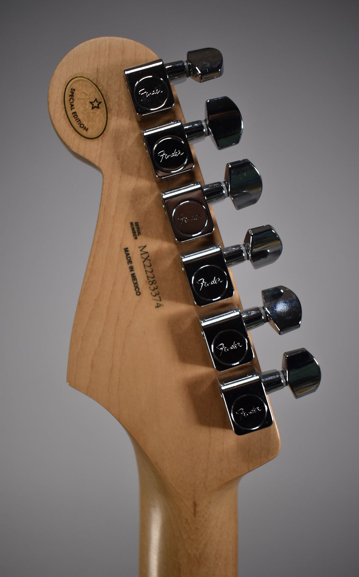 The back of the guitar's headstock and top of the neck, showing six chrome tuning machines and a "Special Edition" decal.