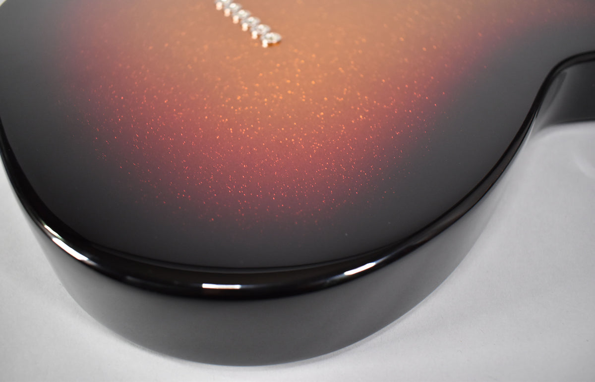 Close-up of the guitar body's lower bout, showing the glossy 3-Color Sparkle Sunburst finish with visible glitter.