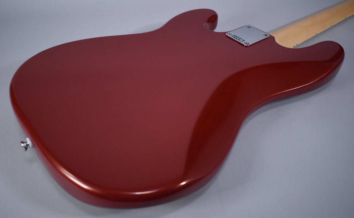 The back of the Candy Cola bass body is shown from the lower bout, with a chrome neck plate and a light maple neck.