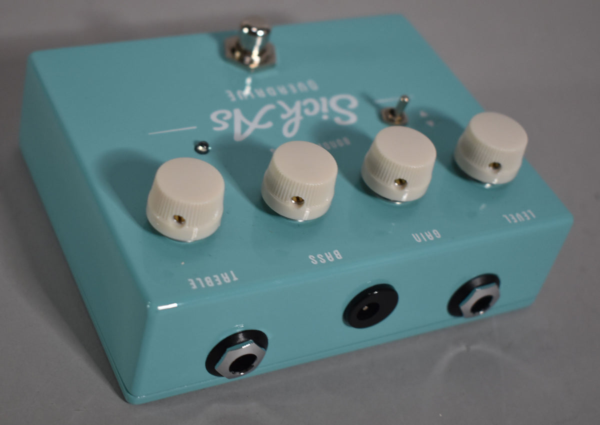 A turquoise Bondi Effects Sick As Overdrive pedal with four white knobs, a footswitch, a toggle switch, and three input jacks.