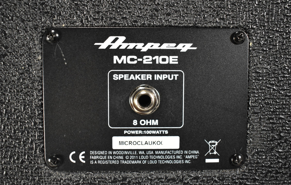 Close-up of the black metal input panel on the back of the speaker cabinet, showing the single chrome speaker input jack.