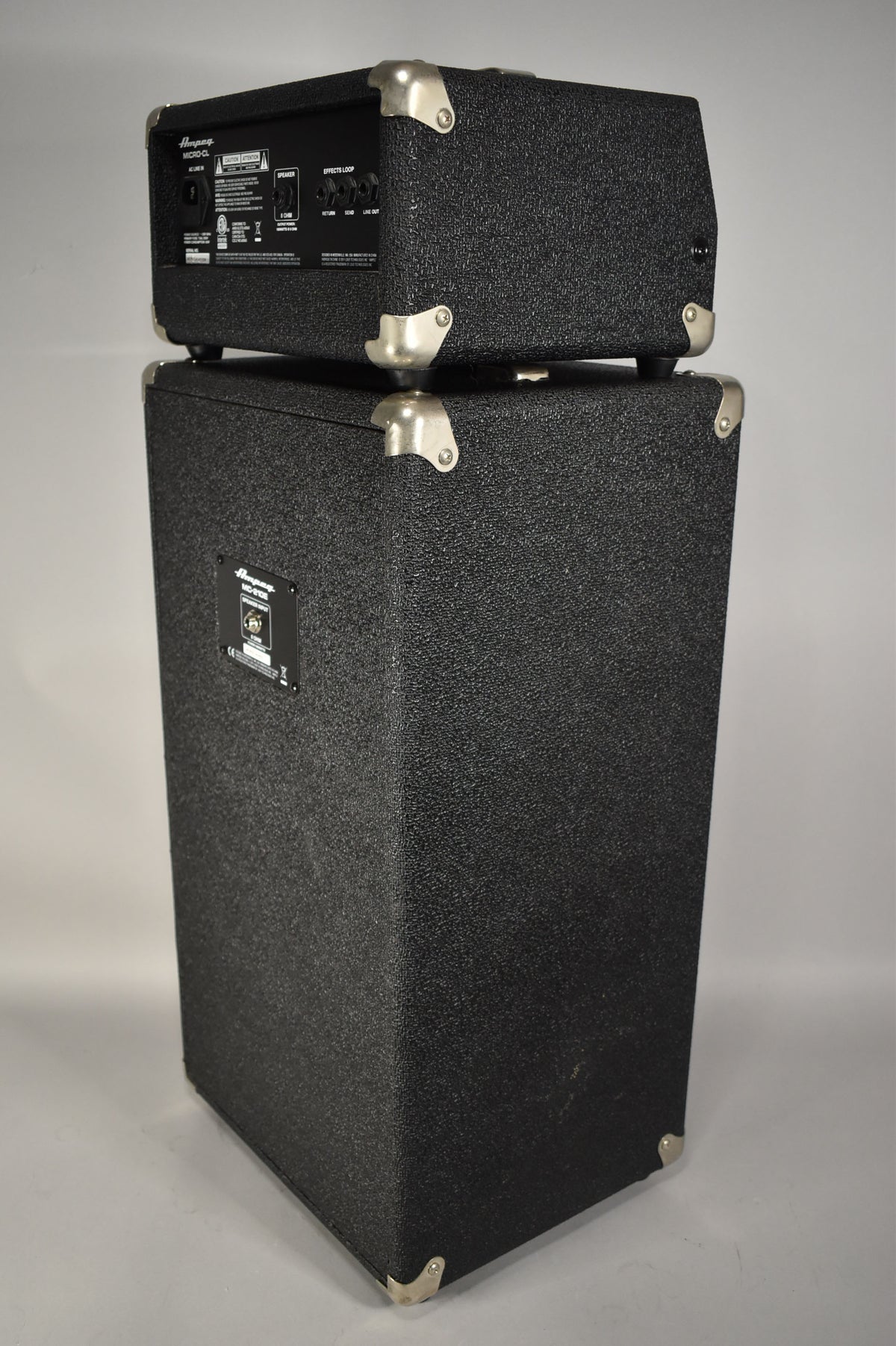 Rear view of the black textured amp head and speaker cabinet, showing the input panel with "Effects Loop" and "Line Out" jacks.