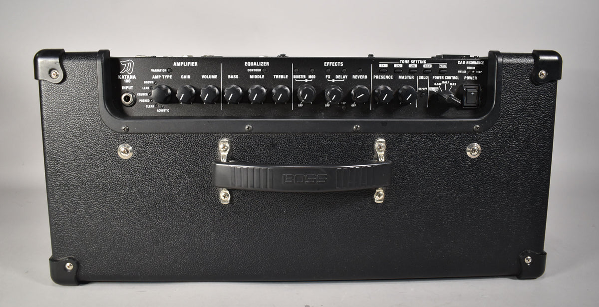Front view of a black Boss Katana-100 Gen 3 guitar amplifier, showing its control panel with various knobs and switches.