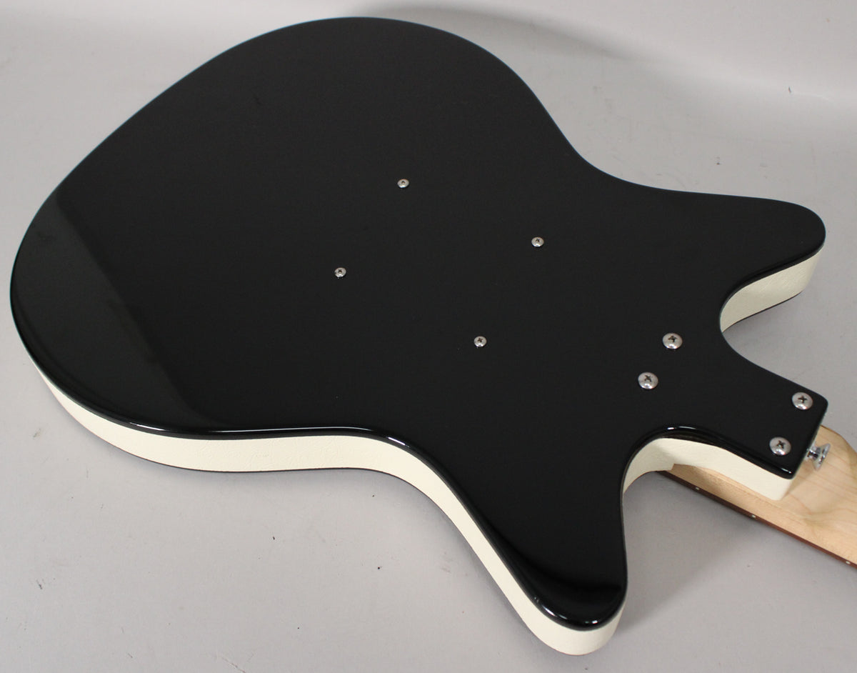 The guitar's glossy black back with white binding is angled, showing the neck joint with four screws and four smaller screws on the body.