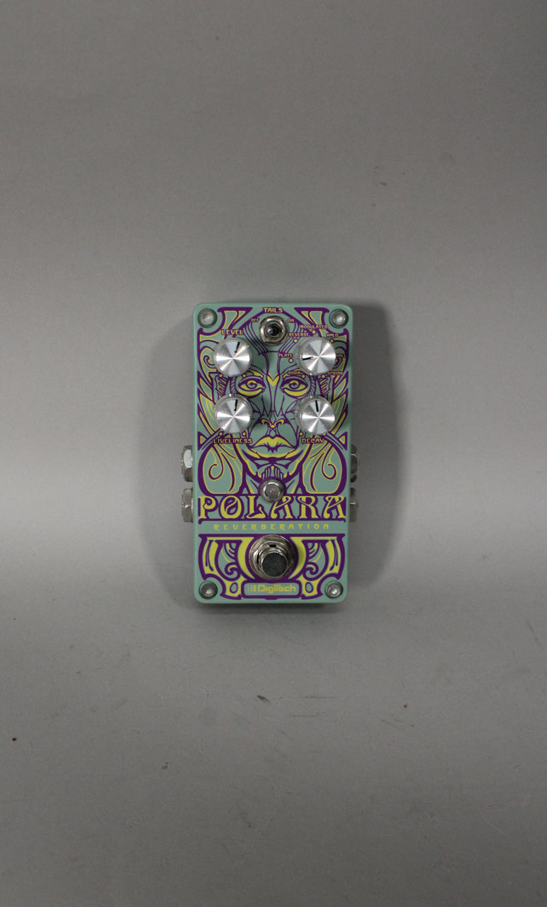 A light blue pedal with purple and yellow psychedelic art, four silver knobs, a toggle switch, and a footswitch.