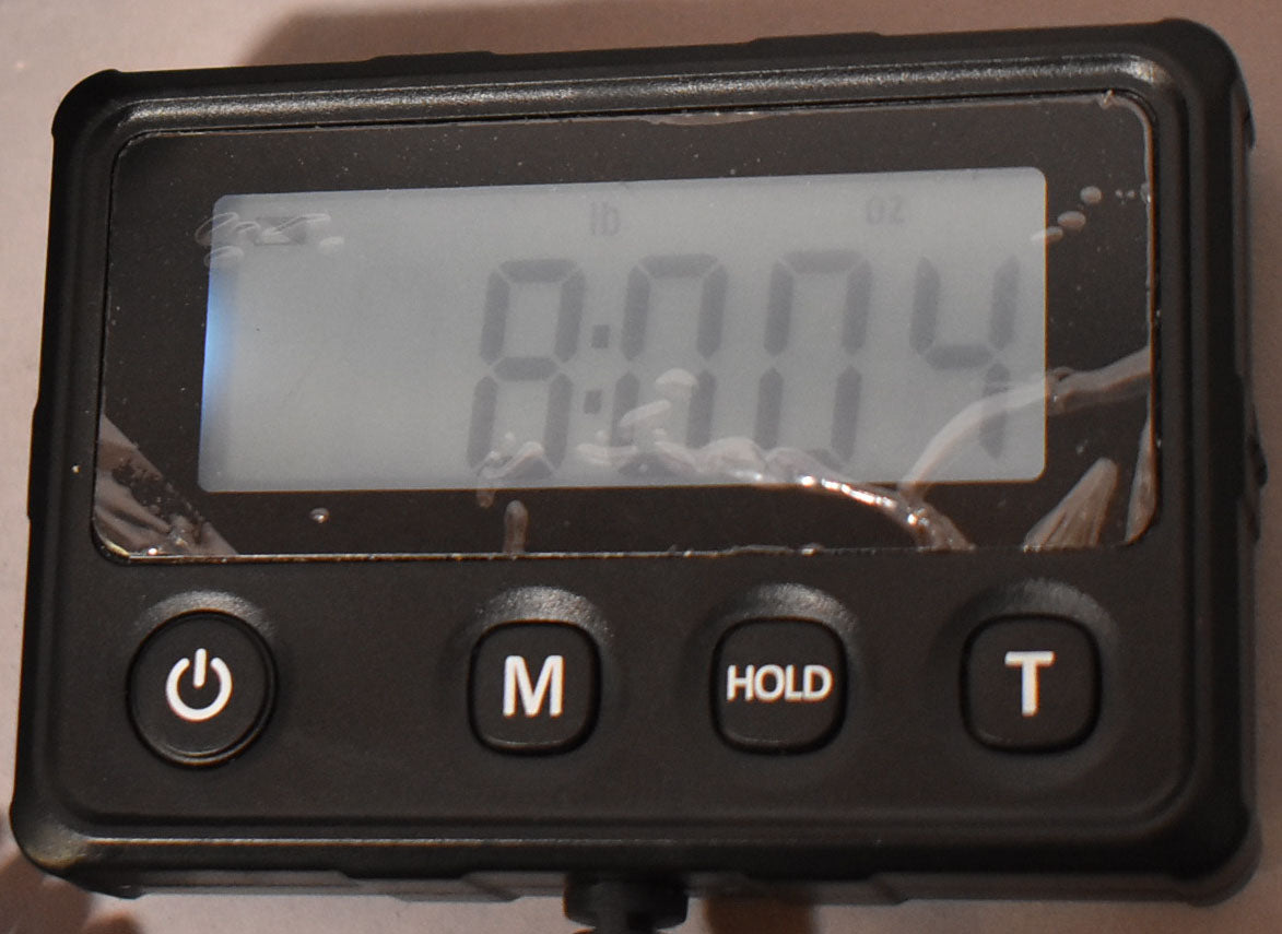 A digital scale displays "lb" and "oz" with a reading of "8.004".