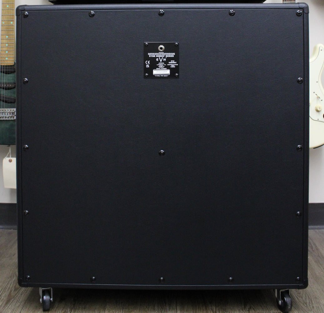 Rear view of the black textured cabinet, showing the input jack and a small label, with casters visible below.