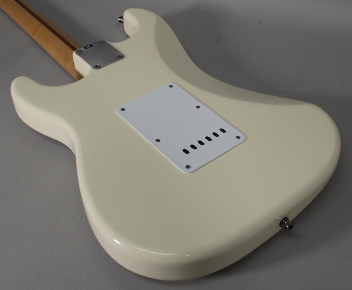 Rear view of an Olympic White Stratocaster body, showing the tremolo cavity cover, neck plate, and output jack.
