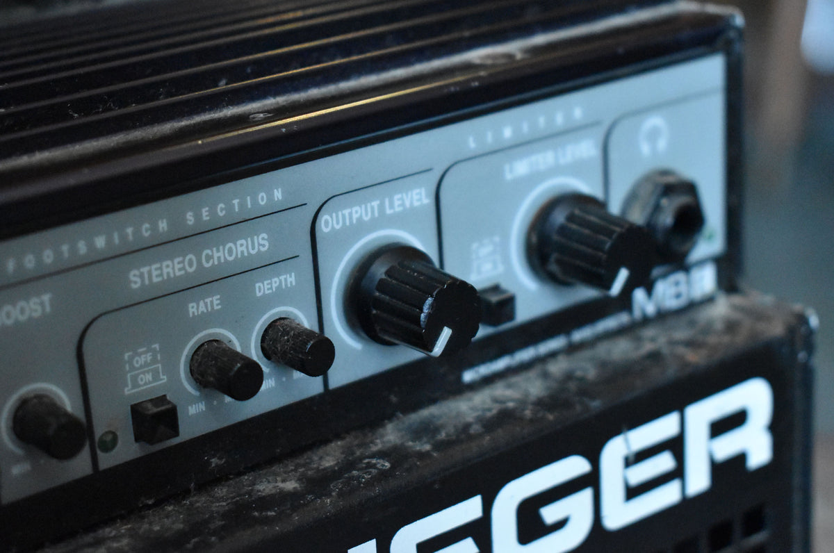 Close-up of the dusty, dark grey control panel with black knobs, showing the "Stereo Chorus" and "Output Level" sections.