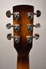 The back of the headstock and top of the neck, showing six chrome tuners on a glossy brown-to-amber sunburst finish.