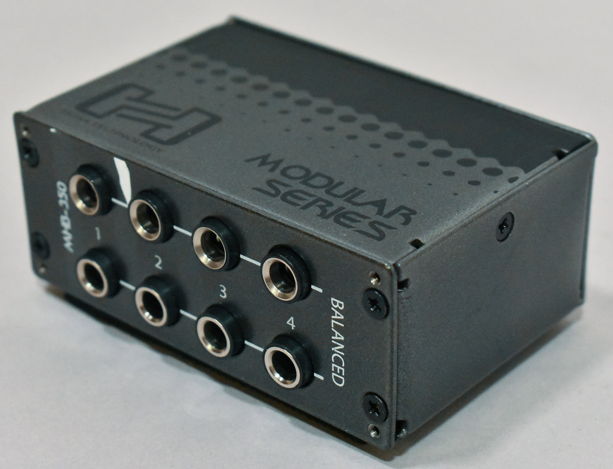 A dark gray patchbay module with eight 1/4-inch TRS jacks on the front, viewed from a slight angle revealing the top and right side.