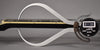 A digital caliper measures the neck relief of the black guitar, showing 0.88mm between the fretboard and strings.