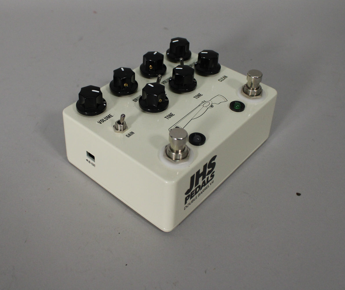 Cream-colored pedal with eight black knobs, two silver footswitches, a silver toggle switch, and a green LED.