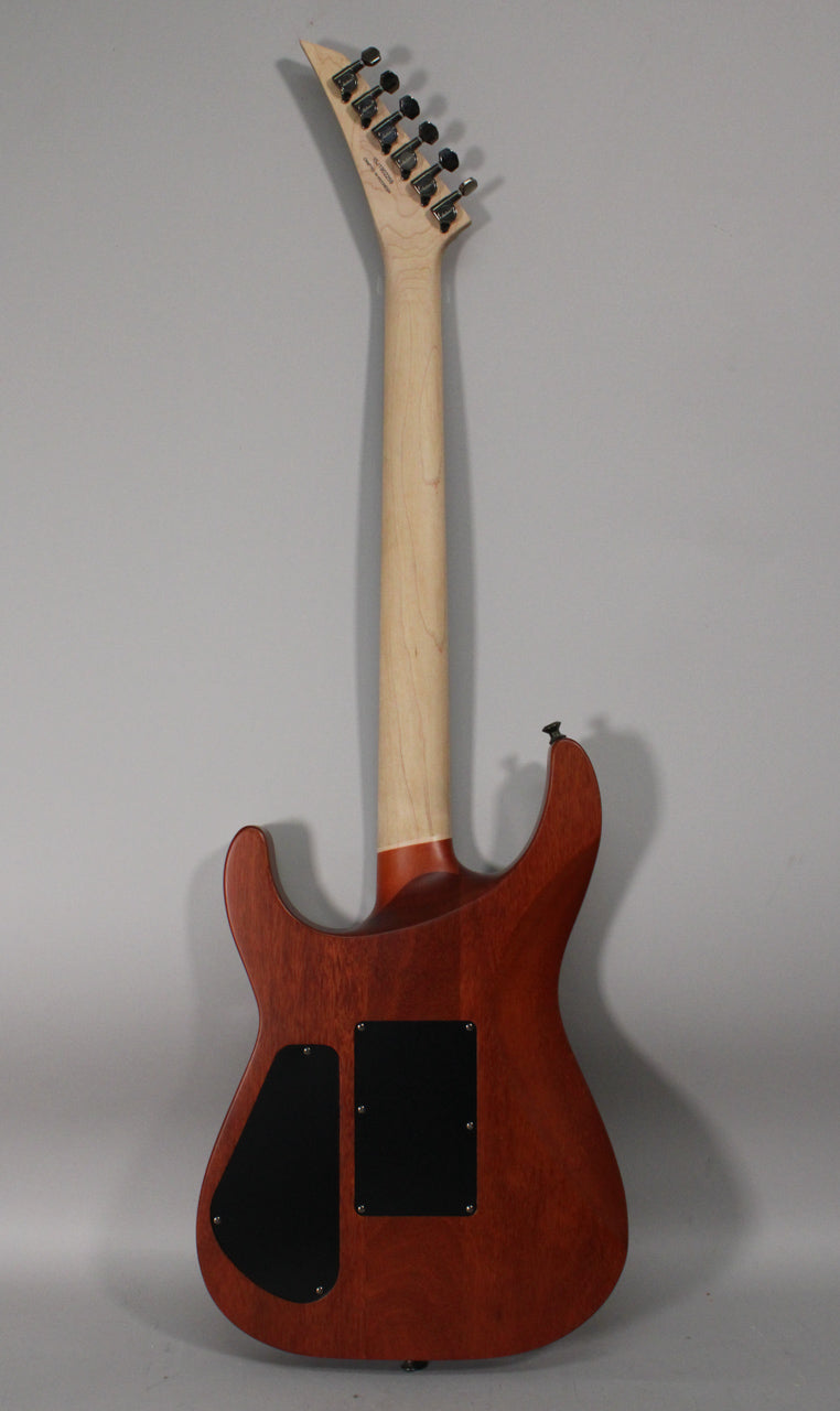 Full back view of the guitar, showing a light wood neck and headstock with six black tuners, and a reddish-brown body with two black control plates.