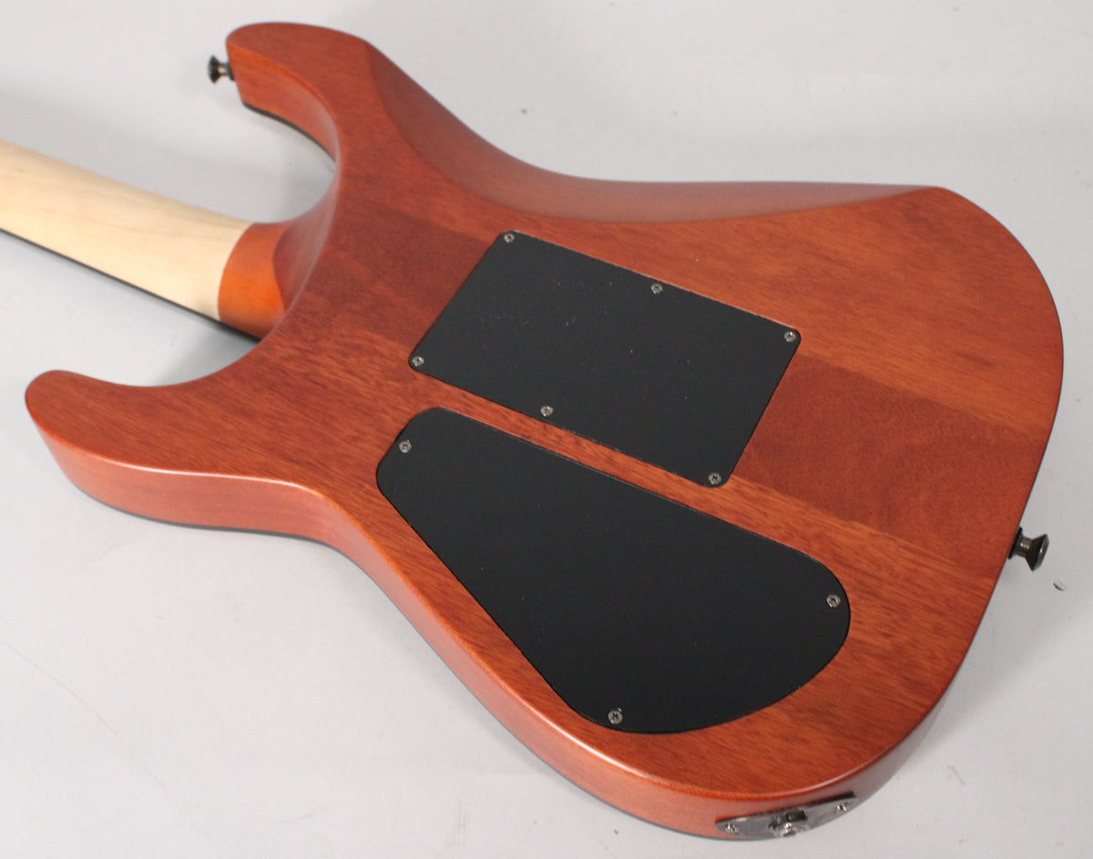 The guitar's mahogany back, with a satin finish, shows two black control cavity covers and a light maple neck joint.
