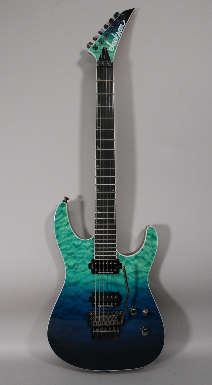Full-length view of a blue-green burst guitar with black hardware, two humbuckers, a tremolo bridge, and a black fretboard.