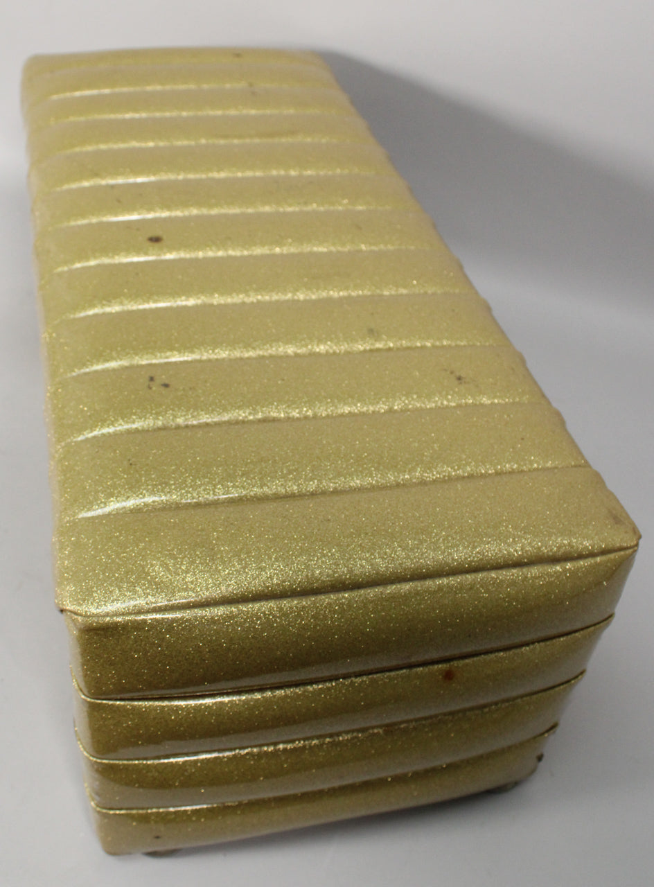 Top-down view of the gold sparkle PA head, showing its ribbed, padded exterior with some minor scuffs and wear.