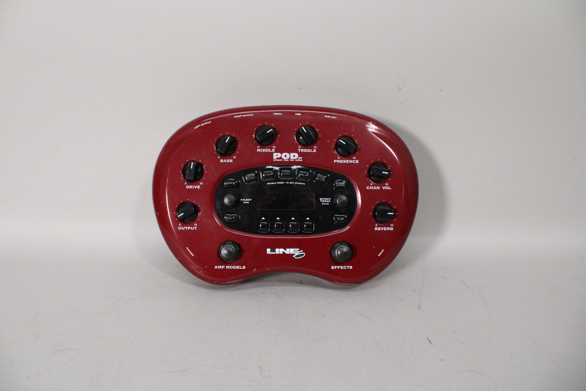 A top-down view of a dark red, kidney-bean-shaped pedal with numerous black knobs and a central display screen.