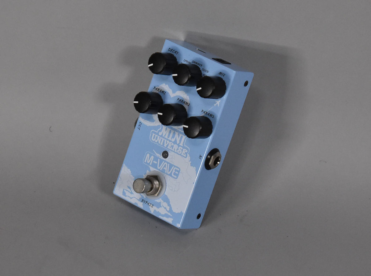A light blue reverb pedal with a white cloud graphic, six black control knobs, and a silver bypass footswitch.