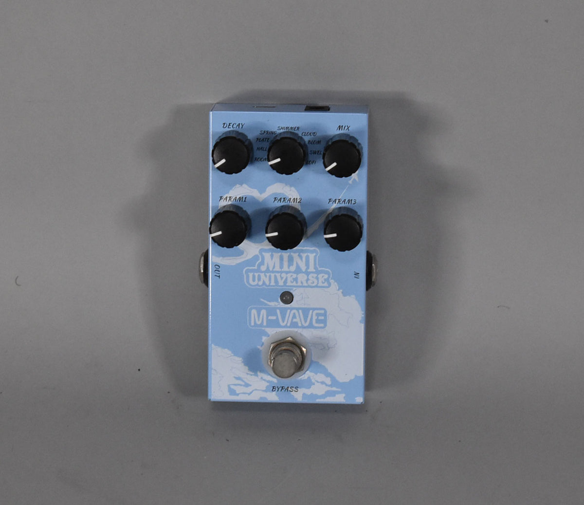 Light blue reverb pedal with a cloud pattern, six black control knobs, and a silver bypass footswitch.