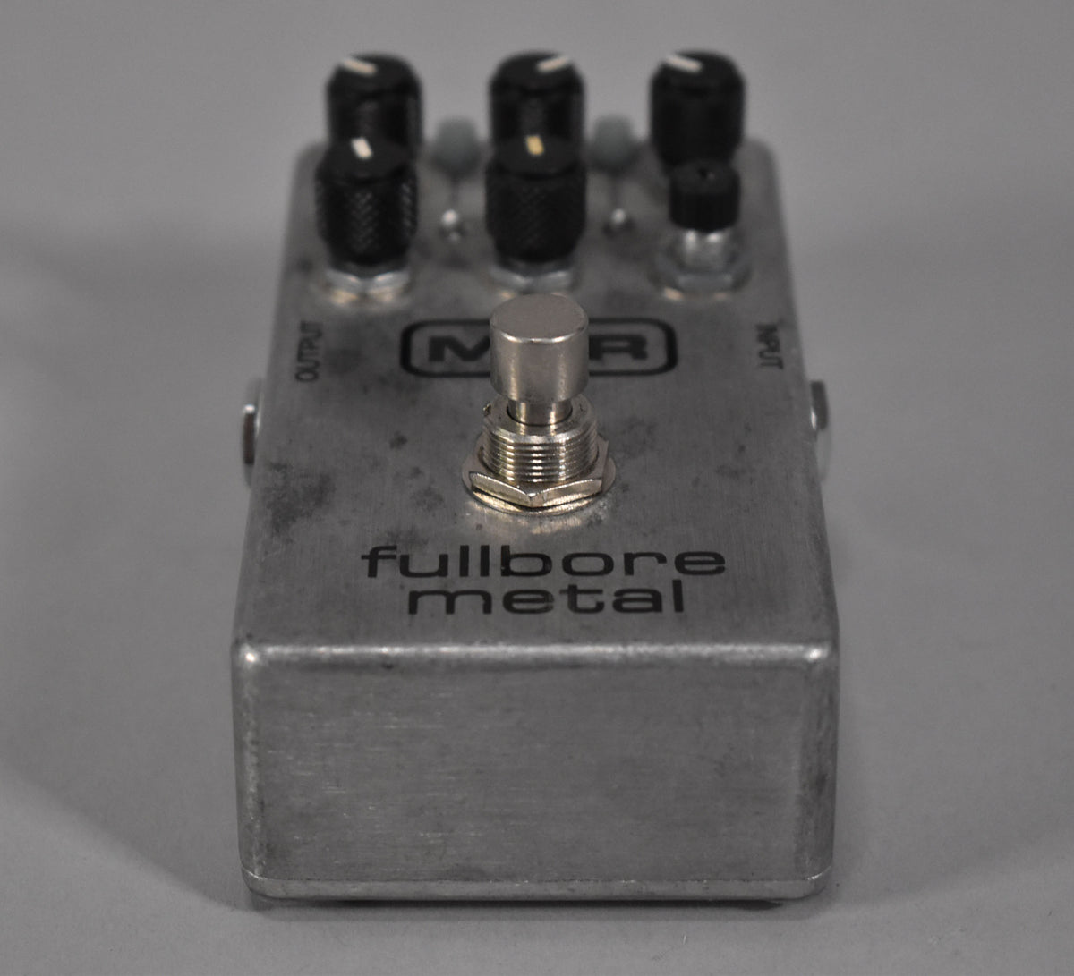 A silver MXR Fullbore Metal distortion pedal with black knobs and a silver footswitch.