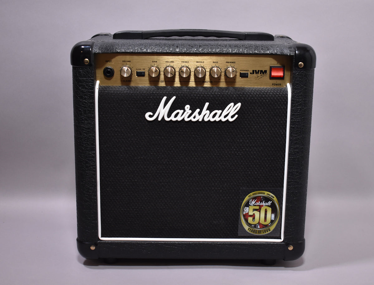 Front view of a black combo amp with a gold control panel, white piping around the speaker grille, and a 50th-anniversary badge.