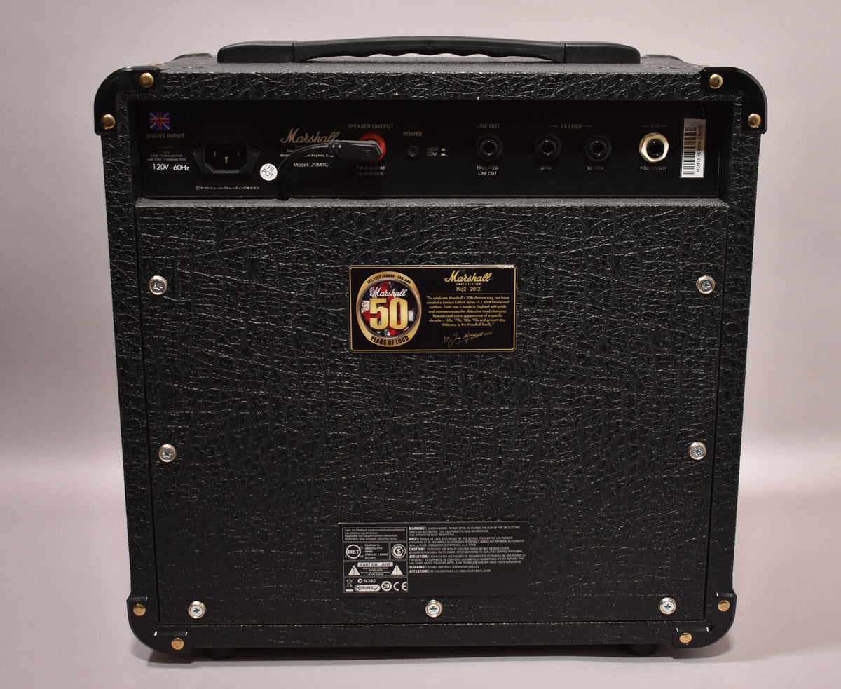 Rear view of the black textured combo amp, showing the input panel, a gold 50th Anniversary plaque, and a carry handle.
