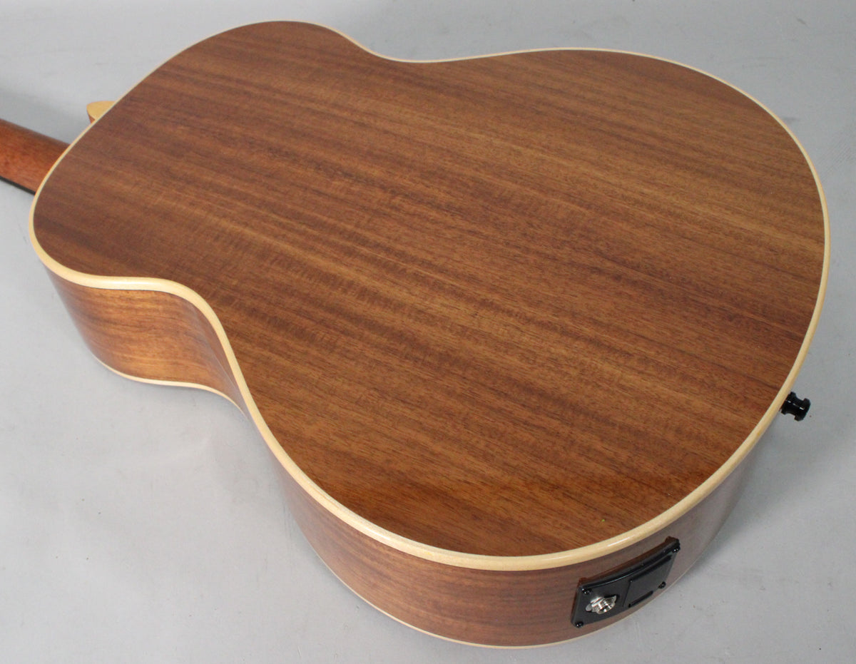 The back of the Koa mini bass, showing its reddish-brown wood grain, light binding, and an output jack on the lower bout.