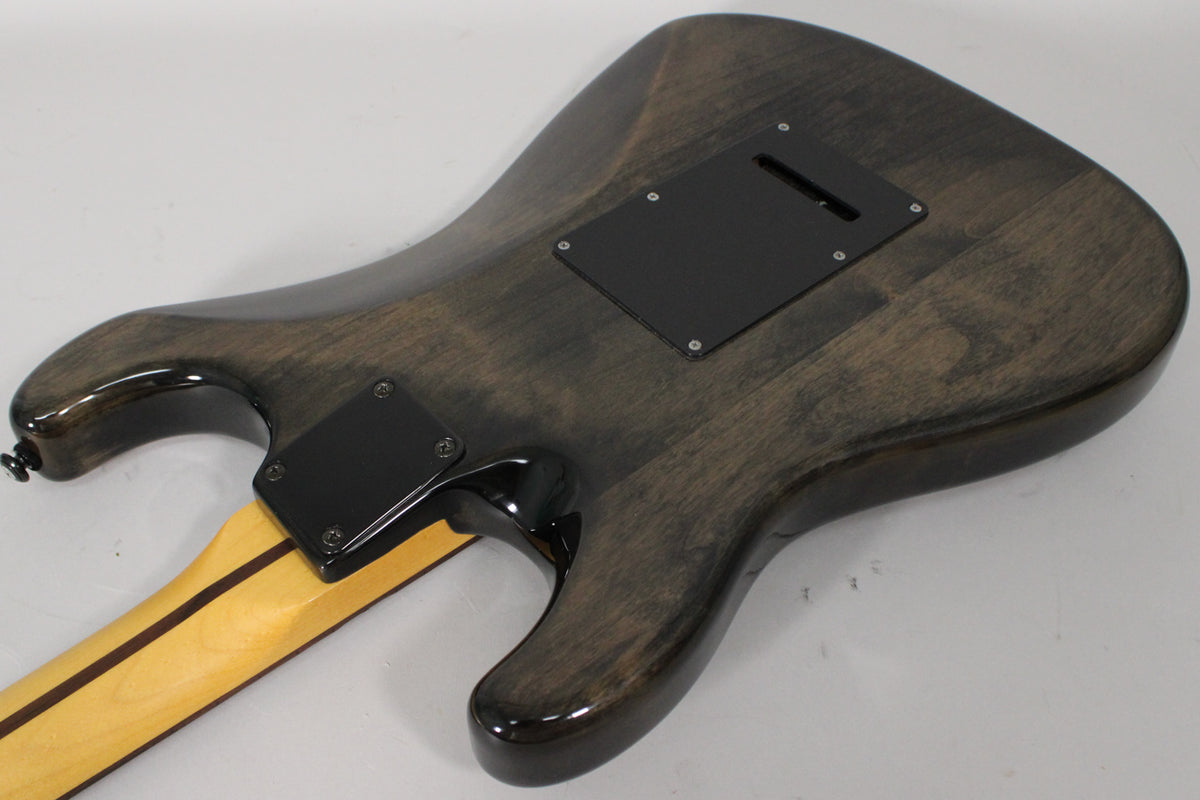The back of a gray gloss electric guitar, angled to show the lower body, neck joint, and upper horn with strap button.