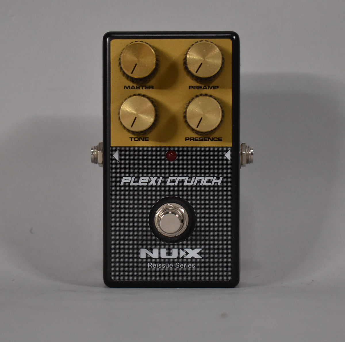 Black and gold pedal with four gold knobs labeled Master, Preamp, Tone, and Presence, plus a silver footswitch.