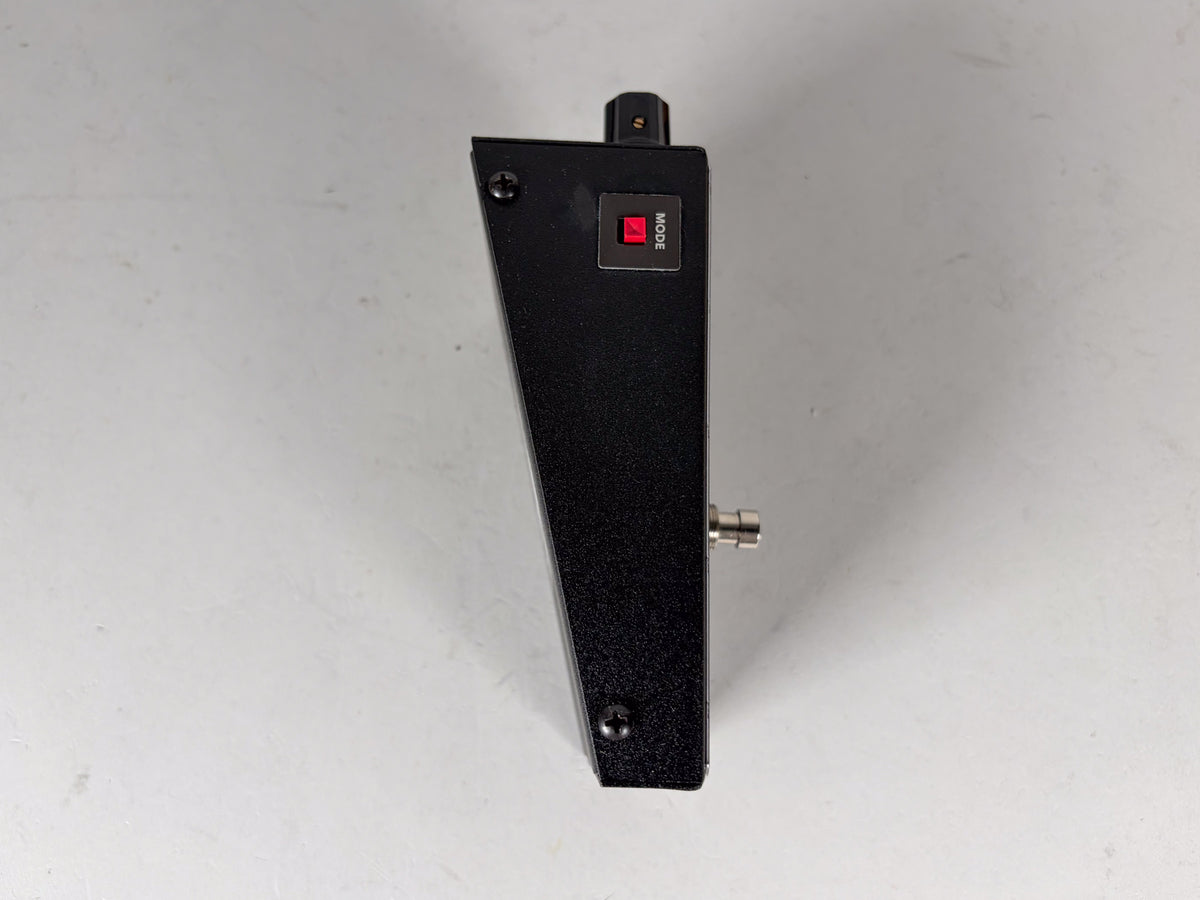The black textured pedal is viewed from the side, revealing a red "MODE" button and a silver input jack.
