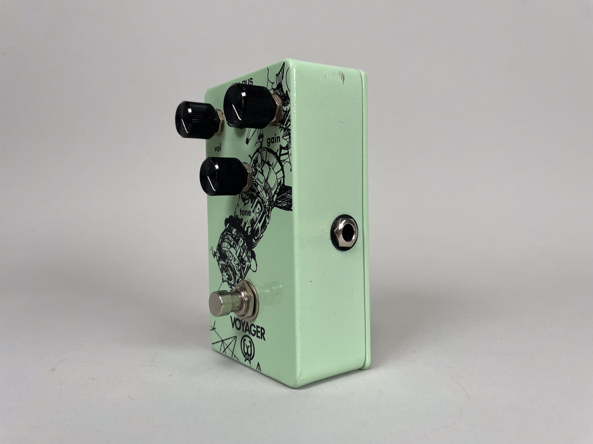 Light green pedal, angled to show the top and right side, with three black knobs and a footswitch on the top.