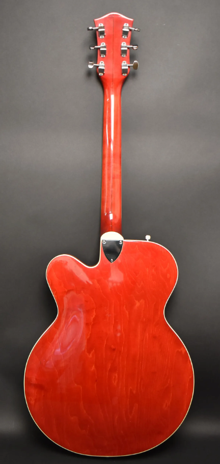 Full rear view of a cherry red hollow body electric guitar with a glossy finish, showing the neck, headstock, and chrome tuners.