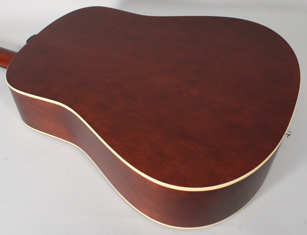 The guitar's dark cherry back and sides are visible from above, with light binding and a strap button on the lower bout.