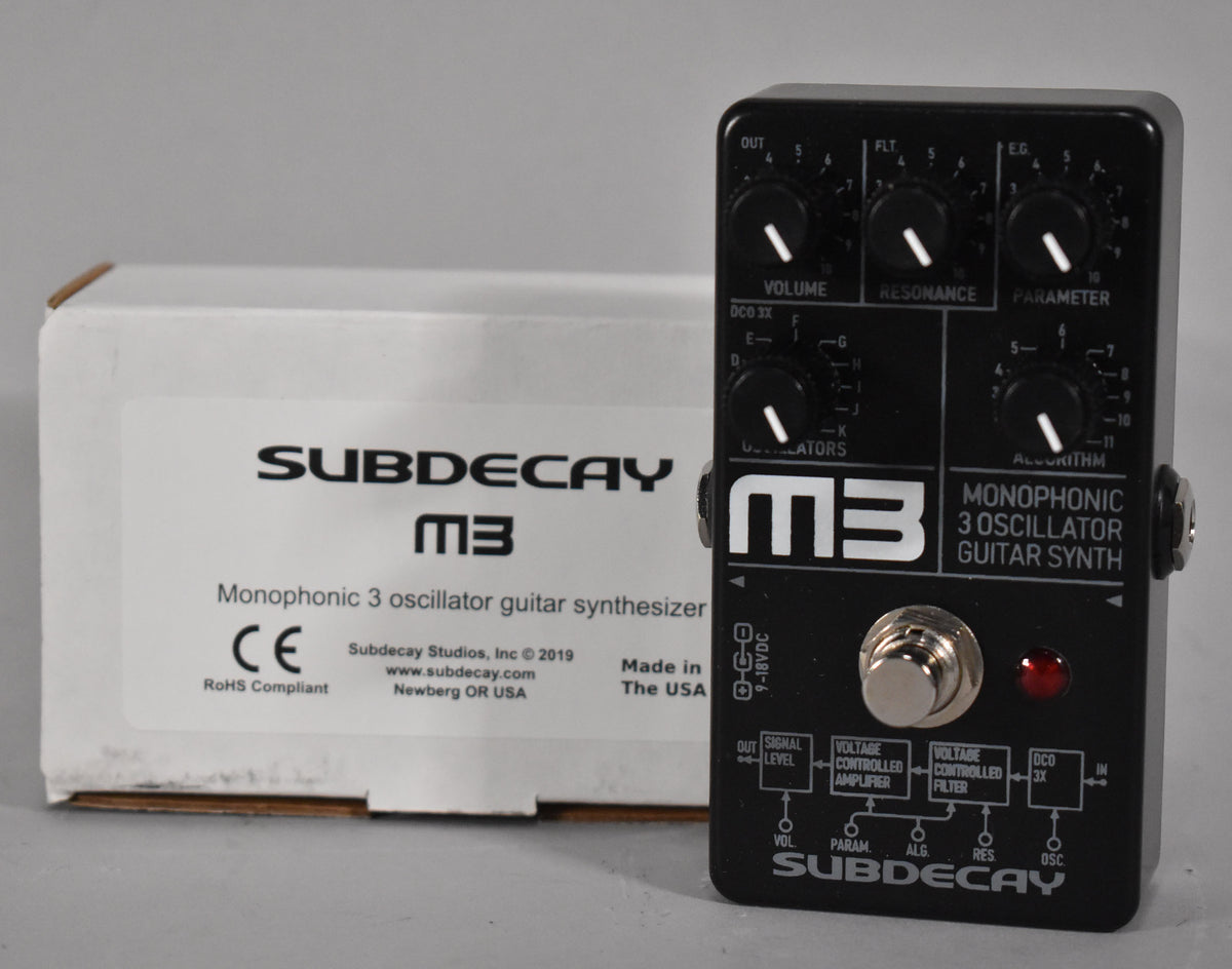 A black guitar synth pedal with white text and graphics, six black knobs, a silver footswitch, and a red LED.