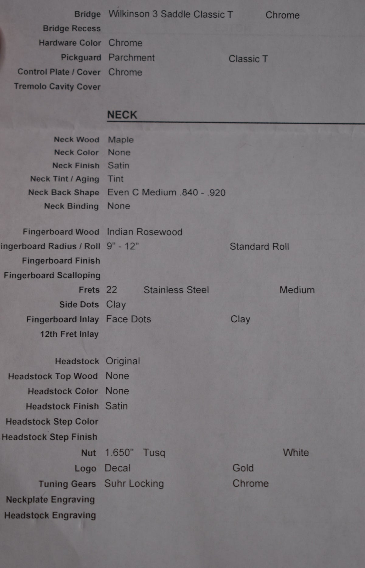 A close-up of a spec sheet for the guitar, detailing neck wood, fingerboard, frets, and headstock features.