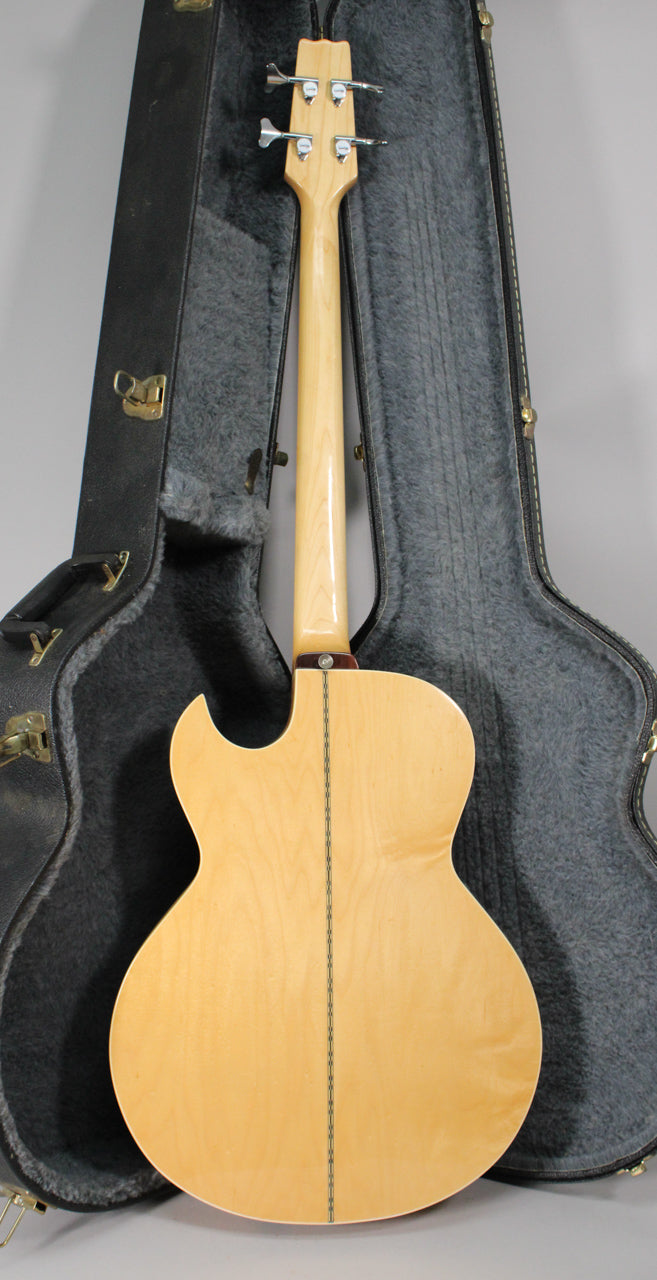 The natural finish acoustic bass is shown from the back, with a light wood neck and body, and a dark center seam.