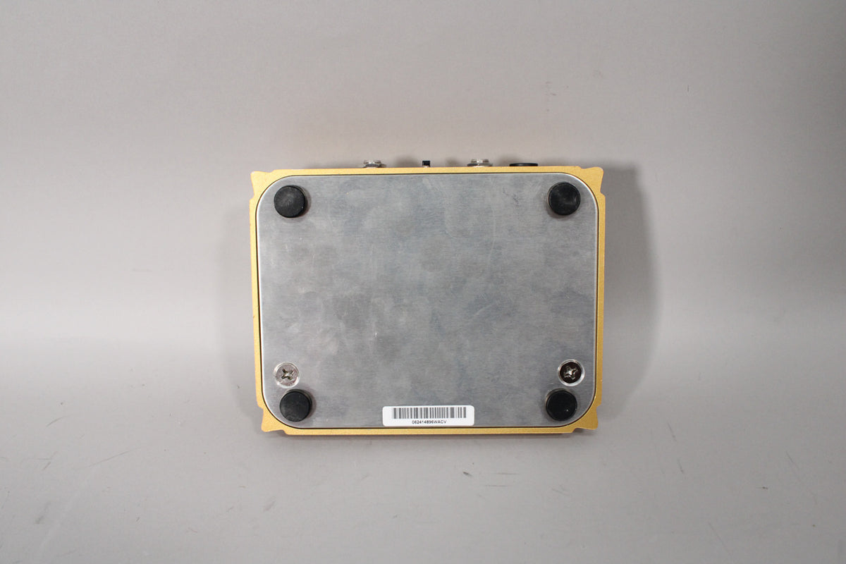 The Centavo Overdrive pedal is shown from the bottom, revealing a brushed metal baseplate with four black rubber feet.