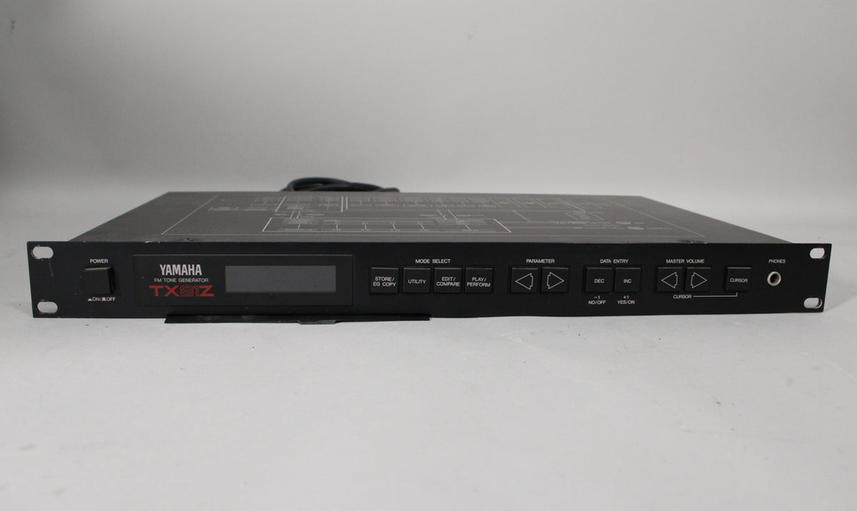 A black rackmount unit with a central display, many small buttons, and a headphone jack on the right, viewed from the front.