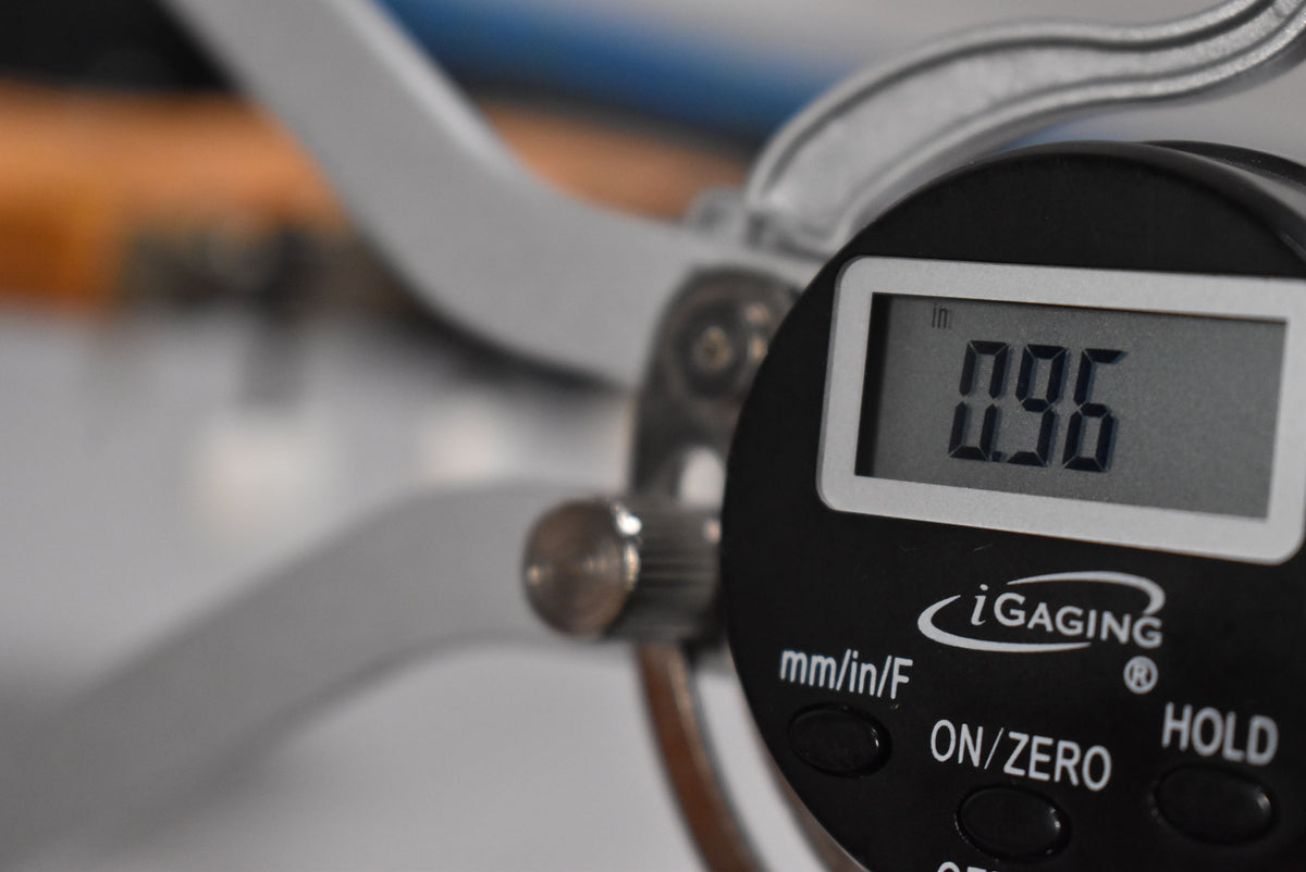 Close-up of a digital caliper showing a reading of 0.96 inches.
