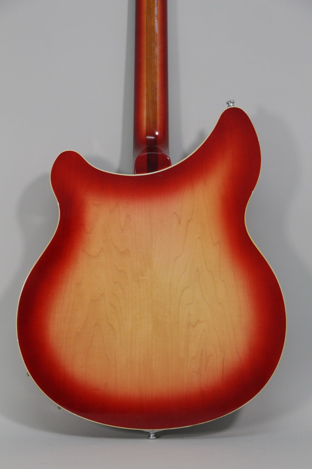 Full rear view of the Fireglo semi-hollow guitar, showing the red-to-natural sunburst finish and a visible strap button.