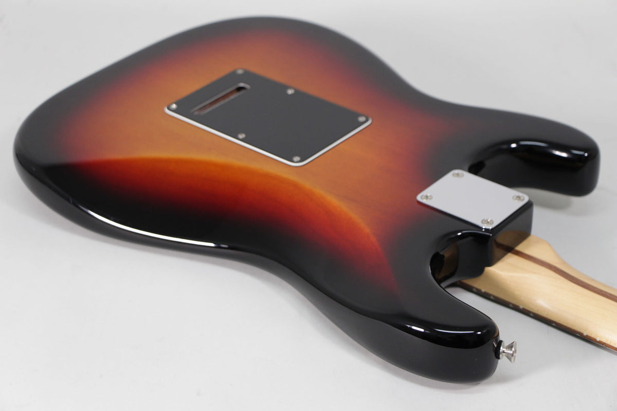 The sunburst Stratocaster's glossy back shows a black tremolo cavity cover, a chrome neck plate, and a strap button.