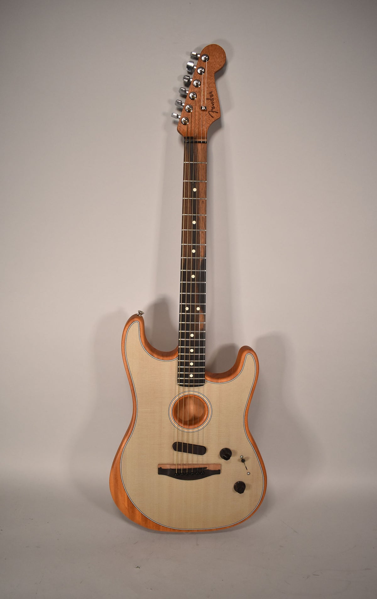 Full-length view of a Fender Acoustasonic Stratocaster with a light wood top, dark wood sides, and a dark fretboard.