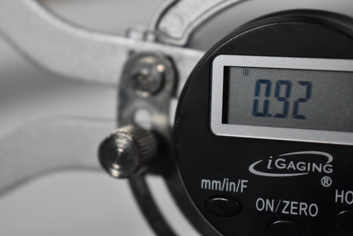 A close-up of an iGaging digital caliper showing a reading of 0.92 inches.