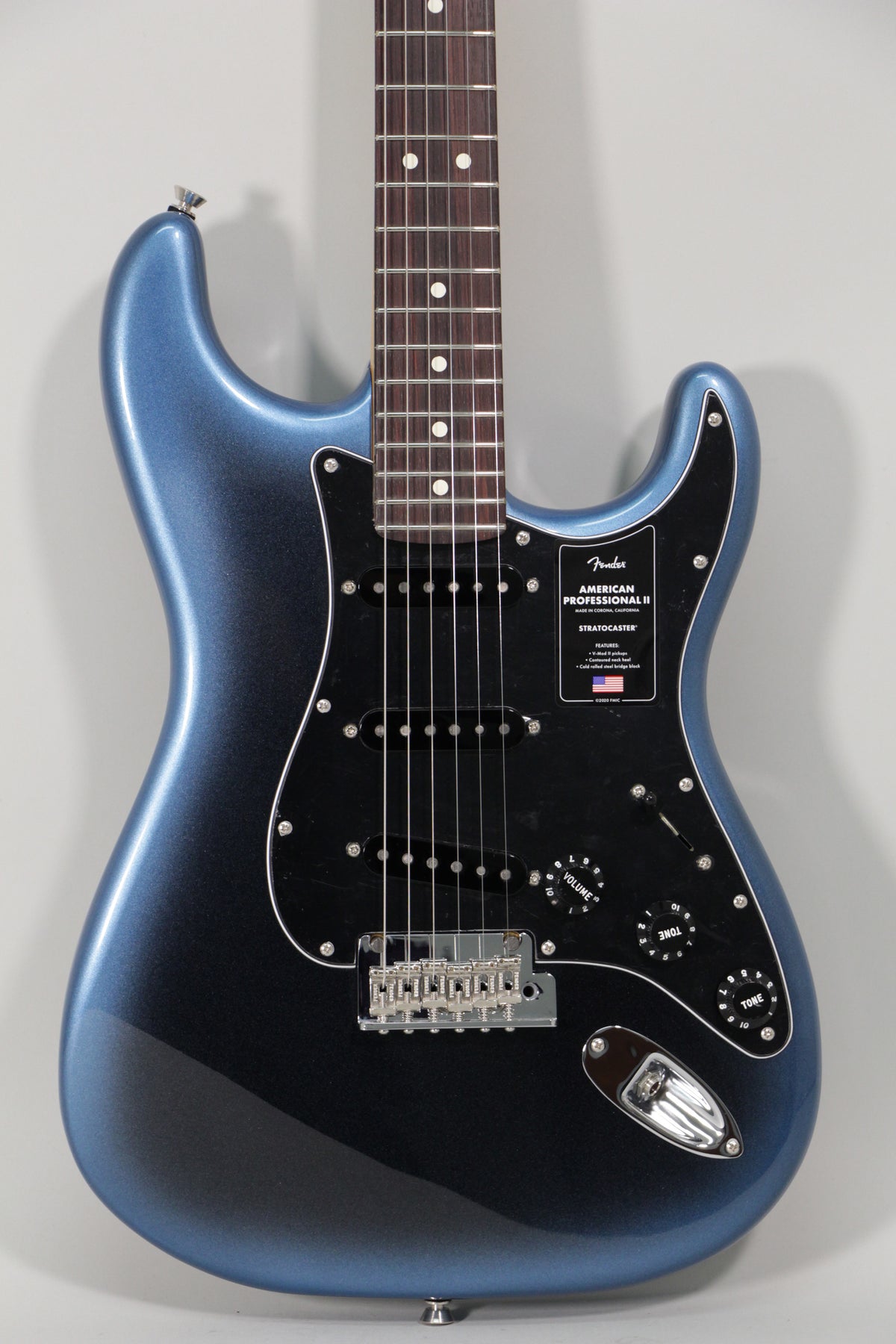 Full front view of a metallic dark blue Stratocaster with a black pickguard, three single-coil pickups, and chrome hardware.