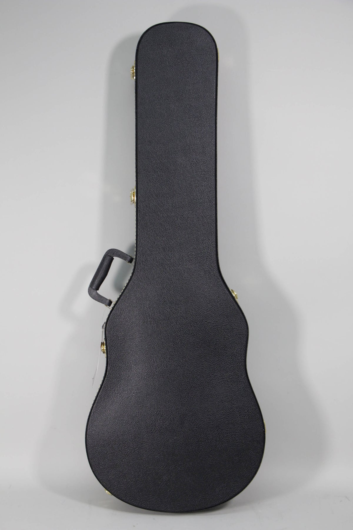 The black hard shell guitar case with a textured finish and gold latches is shown upright, angled slightly to the right.